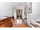 Elegant foyer with hardwood floors, wainscoting, and a view of the front doors and staircase at 105 Everam Ct, Chapel Hill, NC 27516