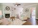 Inviting living room with fireplace, ceiling fan, and an open layout with abundant natural light at 105 Everam Ct, Chapel Hill, NC 27516