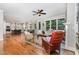 Open-concept living area with hardwood floors, a view of the kitchen, and plentiful natural light at 105 Everam Ct, Chapel Hill, NC 27516