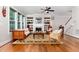 Spacious living room with hardwood floors, built-in shelving, fireplace, and bright natural light at 105 Everam Ct, Chapel Hill, NC 27516