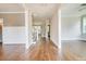 Spacious living space featuring hardwood floors, wainscoting detail, and an open floor plan at 105 Everam Ct, Chapel Hill, NC 27516
