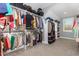 Well organized walk-in closet with shelving and rods, for ample storage at 105 Everam Ct, Chapel Hill, NC 27516