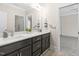 Bathroom featuring double sinks, modern vanity, and animal wall decor at 106 Garrison Farm Rd, Mebane, NC 27302