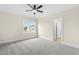 Bedroom with large window, soft neutral tones and plush carpeting at 106 Garrison Farm Rd, Mebane, NC 27302