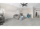 Bonus room with comfortable seating, a TV, and storage for toys and games at 106 Garrison Farm Rd, Mebane, NC 27302