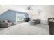 Spacious bonus room with a cozy seating area, a TV, and ample natural light at 106 Garrison Farm Rd, Mebane, NC 27302