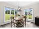 Charming breakfast nook with views of the expansive backyard and lush greenery at 106 Garrison Farm Rd, Mebane, NC 27302