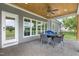 Cozy covered patio featuring a dining set, ceiling fan, and seamless indoor-outdoor flow at 106 Garrison Farm Rd, Mebane, NC 27302