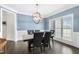 Elegant dining room featuring a modern chandelier and stylish table set for formal dining at 106 Garrison Farm Rd, Mebane, NC 27302