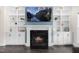 Close up of the fireplace with custom built-ins on either side at 106 Garrison Farm Rd, Mebane, NC 27302