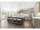Gourmet kitchen with stainless steel appliances, expansive island, and modern cabinetry at 106 Garrison Farm Rd, Mebane, NC 27302