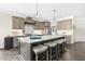Modern kitchen featuring a large island with seating and stylish pendant lighting at 106 Garrison Farm Rd, Mebane, NC 27302