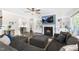 Cozy living room with fireplace, custom built-ins, and plenty of comfortable seating at 106 Garrison Farm Rd, Mebane, NC 27302