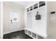 Inviting mudroom featuring a built-in bench with cubbies and a convenient storage system near the entry door at 106 Garrison Farm Rd, Mebane, NC 27302