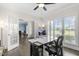 Home office featuring a sleek white desk with a scenic outdoor view through bright windows at 106 Garrison Farm Rd, Mebane, NC 27302