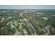 Aerial view of a verdant residential area complete with a golf course in the distance at 106 Rock Nest Ct, Morrisville, NC 27560