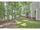 Expansive backyard with lush greenery, mature trees, and a screened-in porch, ideal for outdoor enjoyment at 106 Rock Nest Ct, Morrisville, NC 27560