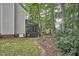 Spacious backyard surrounded by trees, featuring a cozy screened-in porch for outdoor living and entertaining at 106 Rock Nest Ct, Morrisville, NC 27560
