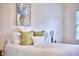Comfortable bedroom with a decorative painting above the bed, enhanced by natural light at 106 Rock Nest Ct, Morrisville, NC 27560