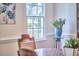 Bright dining area features a large window, accent painting and plant at 106 Rock Nest Ct, Morrisville, NC 27560