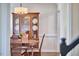 Dining room featuring a wooden table, china cabinet, and elegant decor at 106 Rock Nest Ct, Morrisville, NC 27560