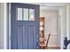 Welcoming entryway featuring a stylish front door and a glimpse into the formal dining room at 106 Rock Nest Ct, Morrisville, NC 27560