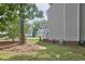 Partial view of the home's side exterior with landscaped yard at 106 Rock Nest Ct, Morrisville, NC 27560