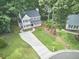 Charming two-story home features a welcoming front porch, neat landscaping, and a long driveway at 106 Rock Nest Ct, Morrisville, NC 27560