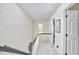 Bright upstairs hallway with neutral walls and carpet at 106 Rock Nest Ct, Morrisville, NC 27560