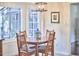 Breakfast nook featuring light fixture, table, and chairs, with an open layout to the kitchen at 106 Rock Nest Ct, Morrisville, NC 27560