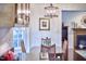Breakfast nook featuring light fixture and seating, with views to the living room and kitchen at 106 Rock Nest Ct, Morrisville, NC 27560