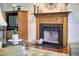 Living room featuring a wooden fireplace and hardwood floors with fireplace at 106 Rock Nest Ct, Morrisville, NC 27560