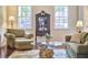Living room with hardwood floors, comfortable seating and natural light at 106 Rock Nest Ct, Morrisville, NC 27560