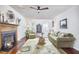 Spacious living room with fireplace, hardwood floors and comfortable seating at 106 Rock Nest Ct, Morrisville, NC 27560