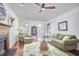 Living room with fireplace, hardwood floors and comfortable seating at 106 Rock Nest Ct, Morrisville, NC 27560