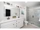 Modern bathroom features double sinks, a large mirror and glass enclosed shower at 109 Periwinkle Pl, Clayton, NC 27527