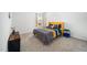 Stylish bedroom features a modern bed set, large window and neutral color scheme at 109 Periwinkle Pl, Clayton, NC 27527