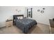 This bedroom features neutral walls, carpet, and a comfy bed at 109 Periwinkle Pl, Clayton, NC 27527