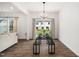 Bright dining room features a modern light fixture and view to the backyard at 109 Periwinkle Pl, Clayton, NC 27527