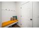 Functional mudroom featuring a convenient bench and coat hooks near the entry at 109 Periwinkle Pl, Clayton, NC 27527