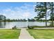 Picturesque pond with fountain and lush greenery surrounding the area at 109 Periwinkle Pl, Clayton, NC 27527