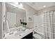 The bathroom includes a shower-tub combo, and a large vanity with a well-lit mirror at 1108 Renewal Pl, Raleigh, NC 27603