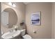 A half bathroom featuring elegant fixtures and stylish decor, providing convenience for guests and residents at 1108 Renewal Pl, Raleigh, NC 27603