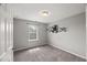 Neutral bedroom offers natural light and stylish wall decor and shelves for a personalized touch at 1108 Renewal Pl, Raleigh, NC 27603