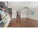 Open-concept living room with hardwood floors, flowing seamlessly from the entryway and providing ample space for relaxation at 1108 Renewal Pl, Raleigh, NC 27603