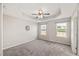 Bright main bedroom with carpet, fan, and natural light offers a relaxing retreat at 1108 Renewal Pl, Raleigh, NC 27603