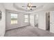 Spacious bedroom with carpet, fan, and windows brings in natural light and comfort at 1108 Renewal Pl, Raleigh, NC 27603