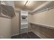 This walk-in closet boasts sturdy wooden shelving and ample space for storage and organization at 1108 Renewal Pl, Raleigh, NC 27603