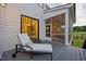 Relaxing back deck with a chaise lounge chair and a screened-in porch for outdoor enjoyment at 111 Stone Park Dr, Wake Forest, NC 27587