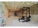 Basement gym under construction with equipment; unfinished ceiling at 111 Stone Park Dr, Wake Forest, NC 27587